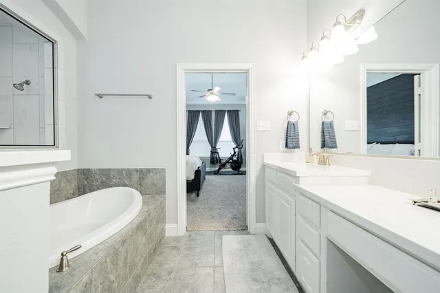 a bathroom with a bathtub and a window