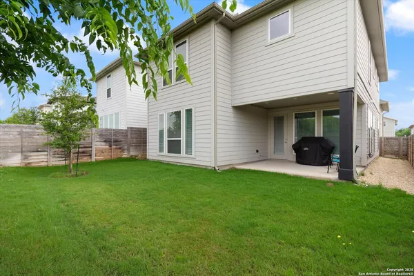 a view of a back yard of the house