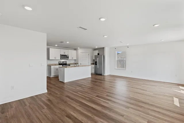 a view of kitchen with wooden floor