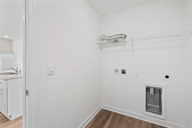 a view of a room with wooden floor