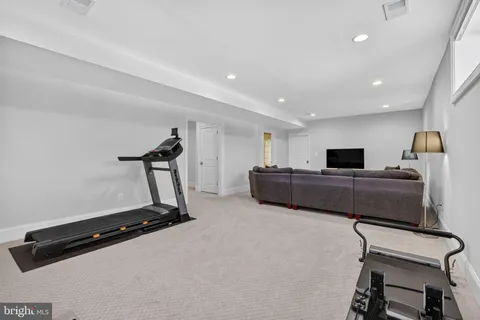 a bedroom with a bed lamp and window