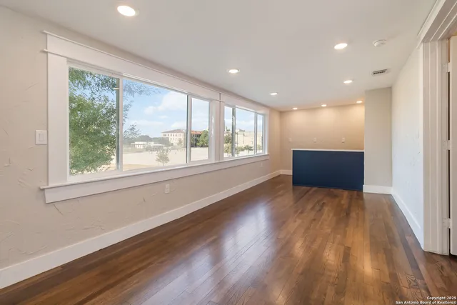 a room with a sink and cabinets