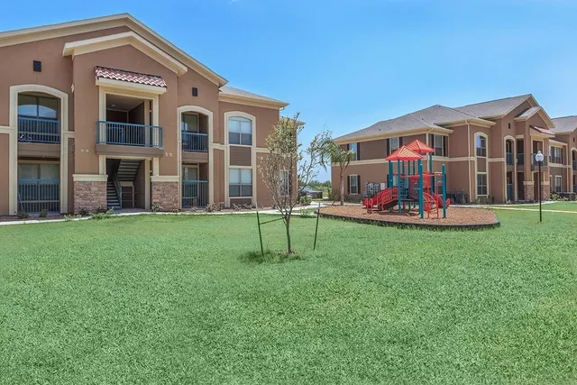 a front view of building with yard