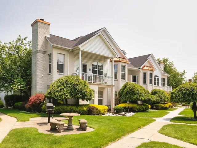 a house that has tree in front of it