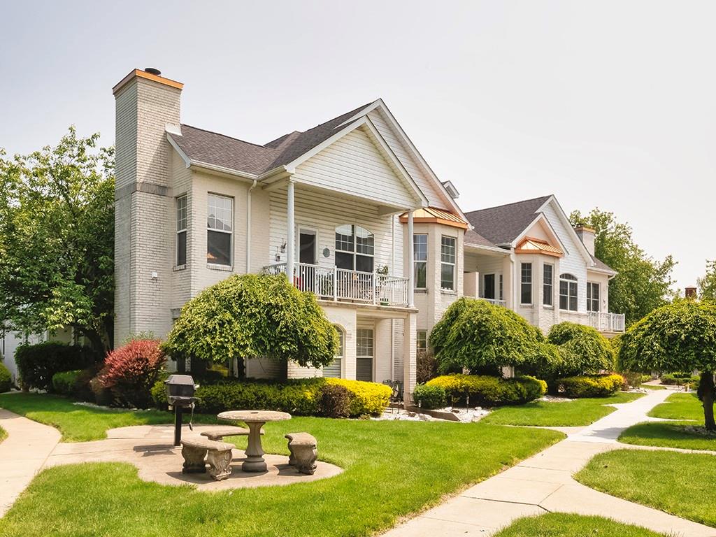 a house that has tree in front of it