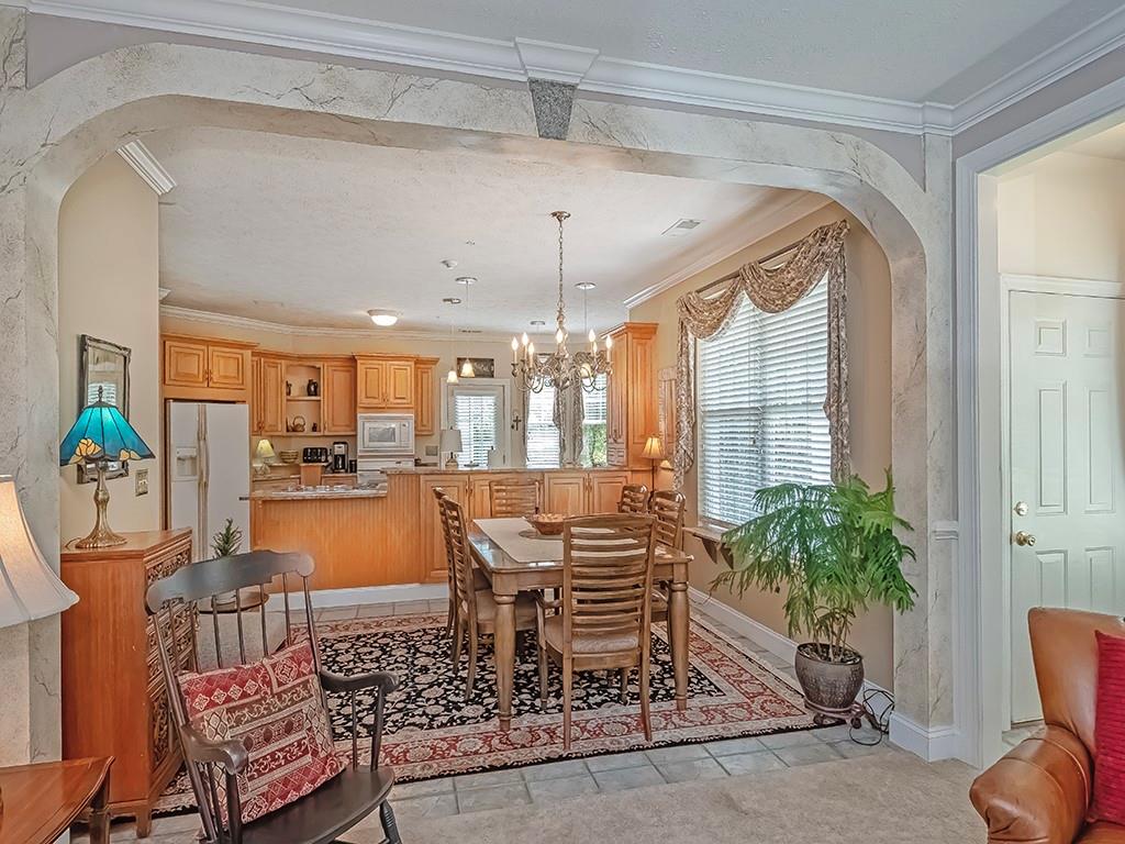 210 Adams Pointe Boulevard, Unit 6 Mars, PA 16046 - Photo 11 of 35 a dining room with furniture and window