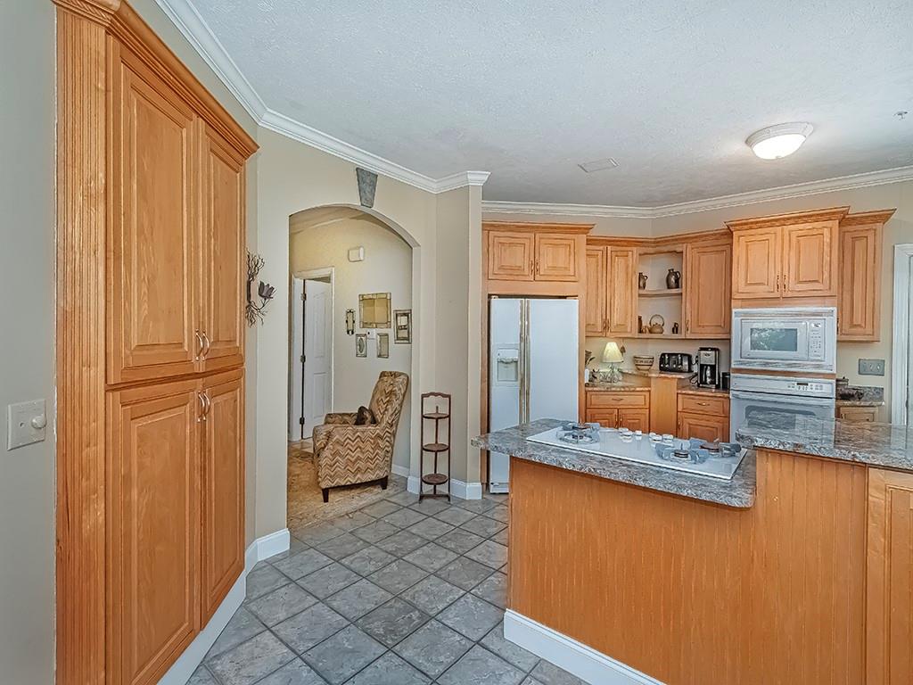 210 Adams Pointe Boulevard, Unit 6 Mars, PA 16046 - Photo 14 of 35 a kitchen with stainless steel appliances granite countertop a refrigerator and a stove top oven
