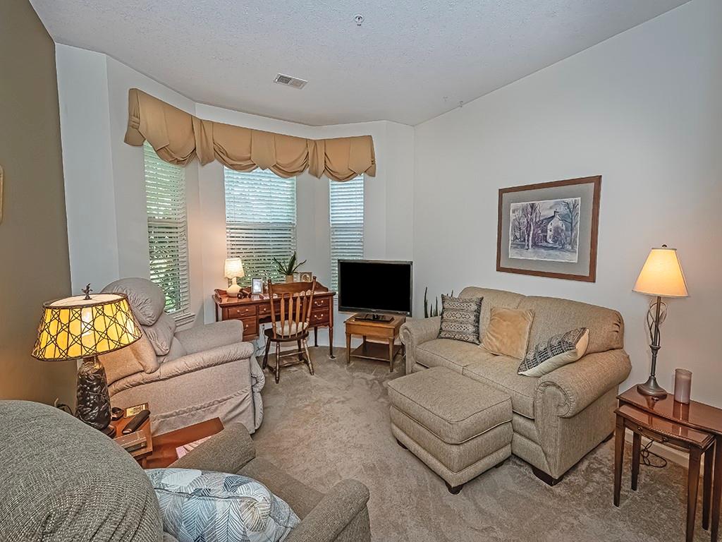 210 Adams Pointe Boulevard, Unit 6 Mars, PA 16046 - Photo 20 of 35 a living room with furniture and a flat screen tv