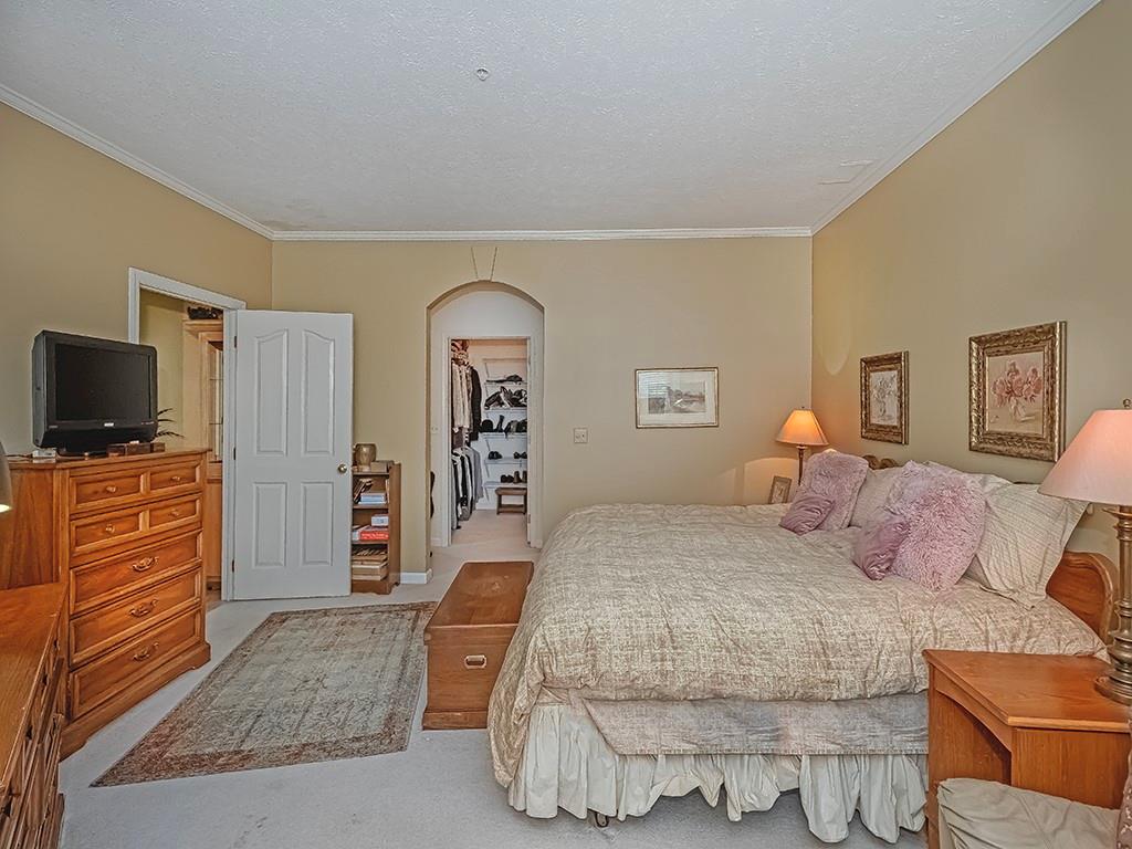 210 Adams Pointe Boulevard, Unit 6 Mars, PA 16046 - Photo 21 of 35 a bedroom with a bed and flat screen tv