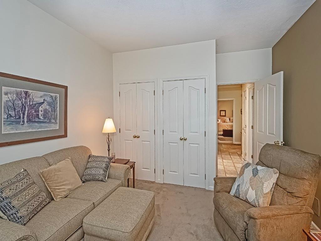 210 Adams Pointe Boulevard, Unit 6 Mars, PA 16046 - Photo 26 of 35 a living room with furniture and a couch