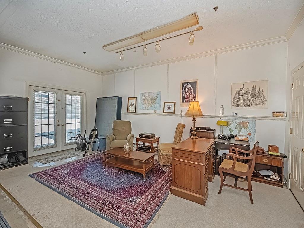 210 Adams Pointe Boulevard, Unit 6 Mars, PA 16046 - Photo 28 of 35 a living room with furniture and a rug