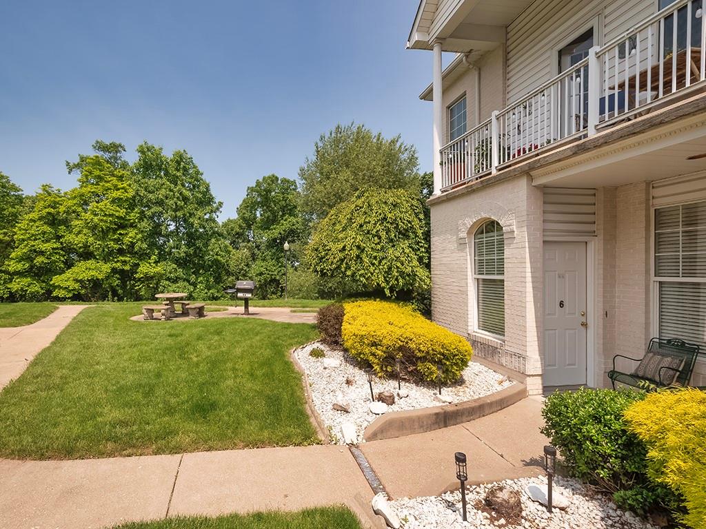 210 Adams Pointe Boulevard, Unit 6 Mars, PA 16046 - Photo 3 of 35 a view of a house with a yard