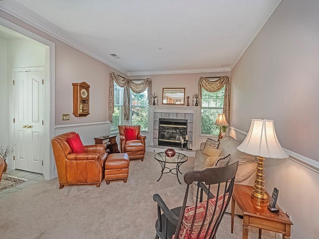 210 Adams Pointe Boulevard, Unit 6 Mars, PA 16046 - Photo 6 of 35 a living room with furniture and a fireplace