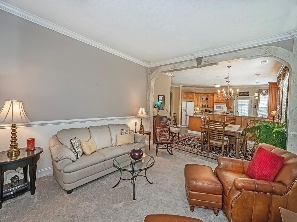 210 Adams Pointe Boulevard, Unit 6 Mars, PA 16046 - Photo 7 of 35 a living room with furniture and a large window
