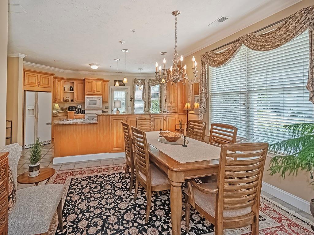 210 Adams Pointe Boulevard, Unit 6 Mars, PA 16046 - Photo 9 of 35 a dining room with furniture and window