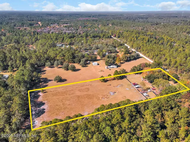 a view of a lake with trees in the background