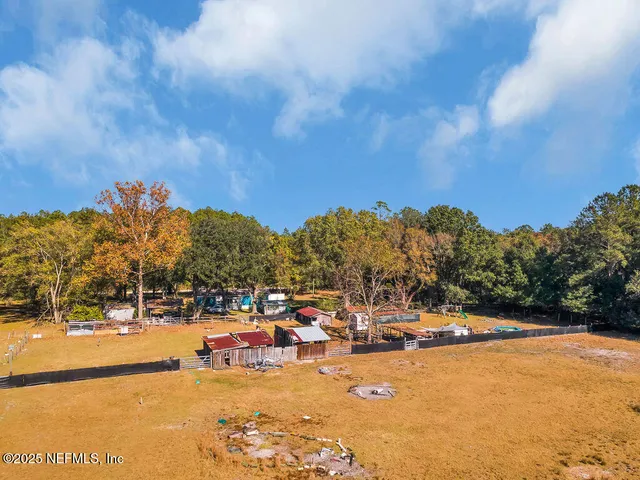a house view with swimming pool in front of it