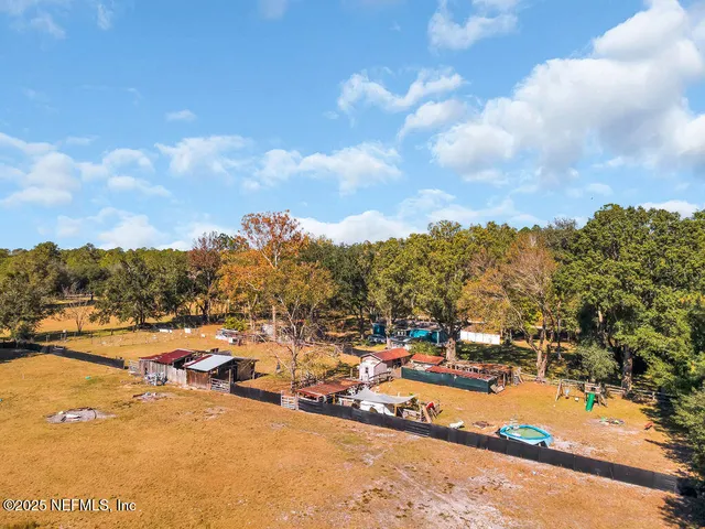 a view of a field with trees