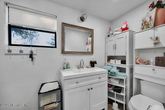a kitchen with a sink a stove and chairs
