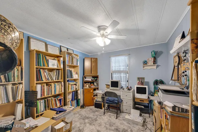 a living room with furniture fireplace and a table