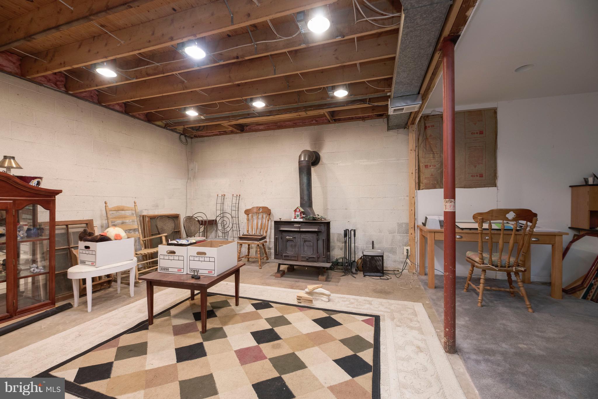 12605 Bristersburg Road Midland, VA 22728 - Photo 24 of 36 Large Partially Finished Basement with wood stove