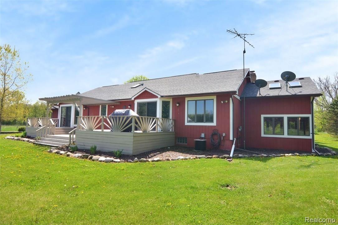 6415 Hogan Road Fenton, MI 48430 - Photo 60 of 72 Large deck with access from the kitchen and master bedroom