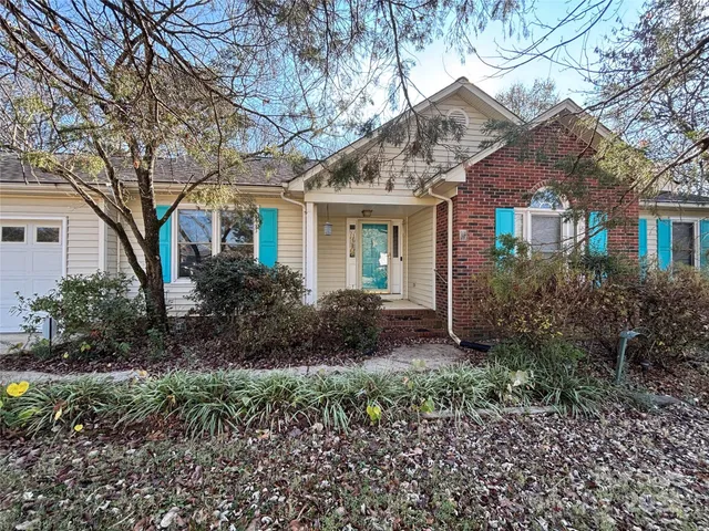 front view of a house with a garden
