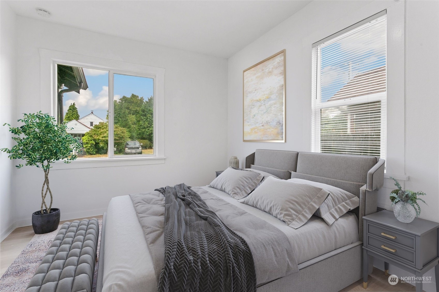 1525 North 3rd Street Renton, WA 98057 - Photo 11 of 38 a bedroom with a large bed and a potted plant