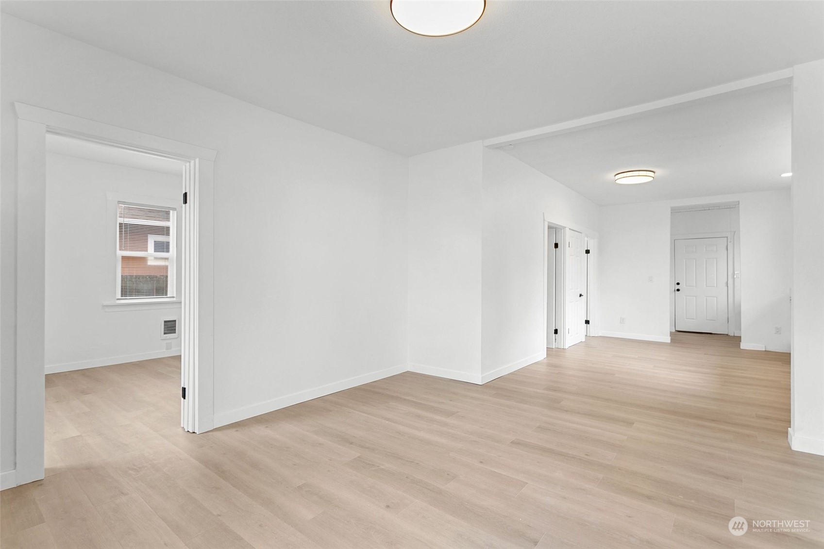1525 North 3rd Street Renton, WA 98057 - Photo 14 of 38 a view of an empty room with wooden floor and closet