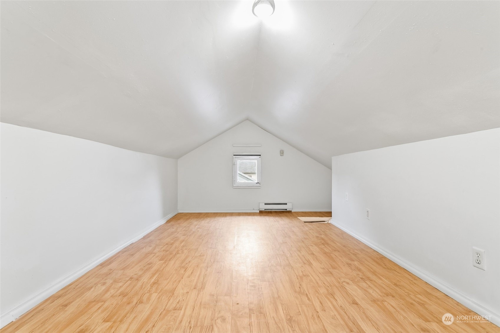 1525 North 3rd Street Renton, WA 98057 - Photo 25 of 38 a view of an empty room with wooden floor and a window