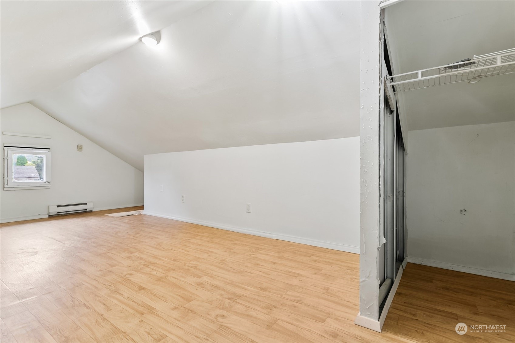 1525 North 3rd Street Renton, WA 98057 - Photo 26 of 38 an empty room with wooden floor and door