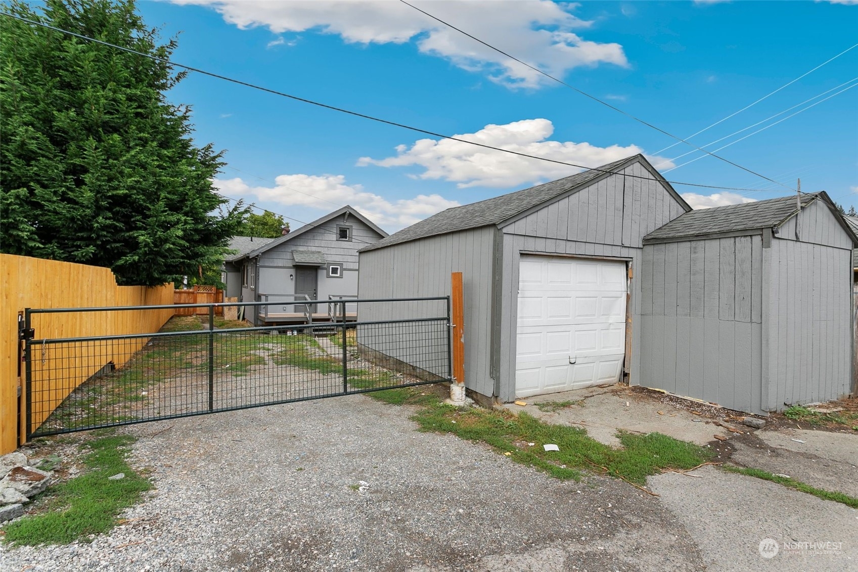 1525 North 3rd Street Renton, WA 98057 - Photo 32 of 38 a view of backyard with large garden and wooden fence