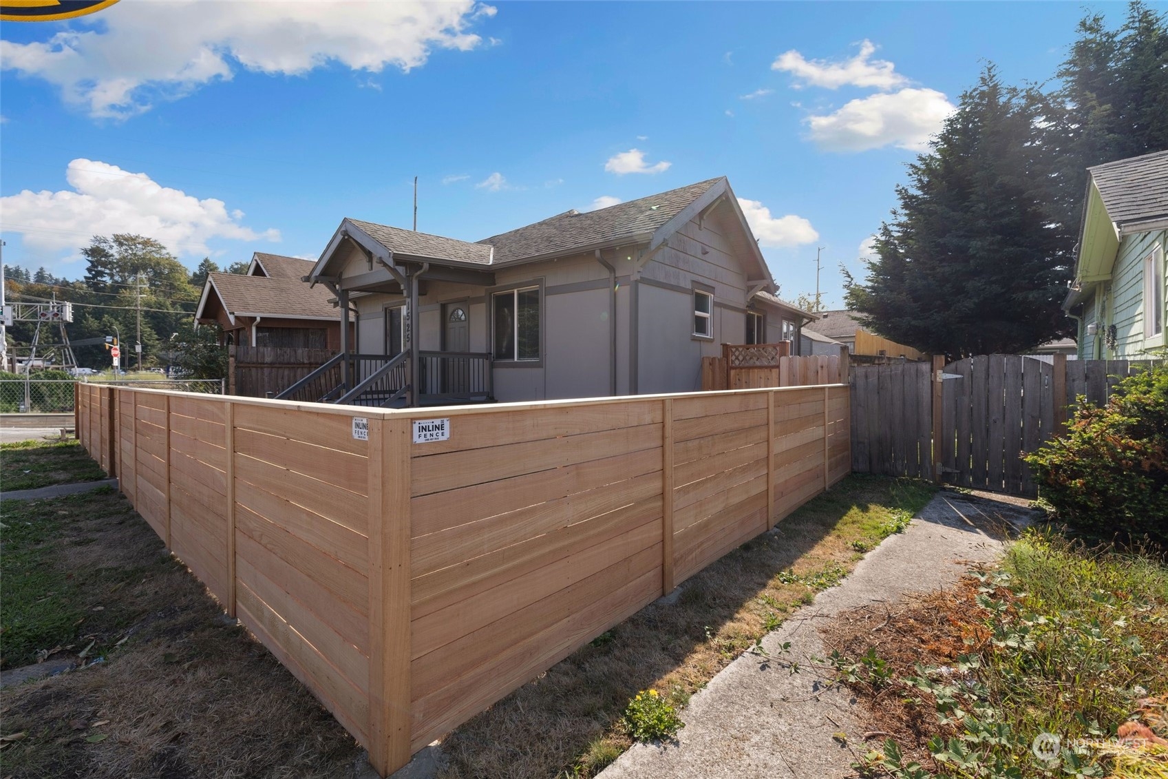 1525 North 3rd Street Renton, WA 98057 - Photo 35 of 38 a front view of a house with a yard