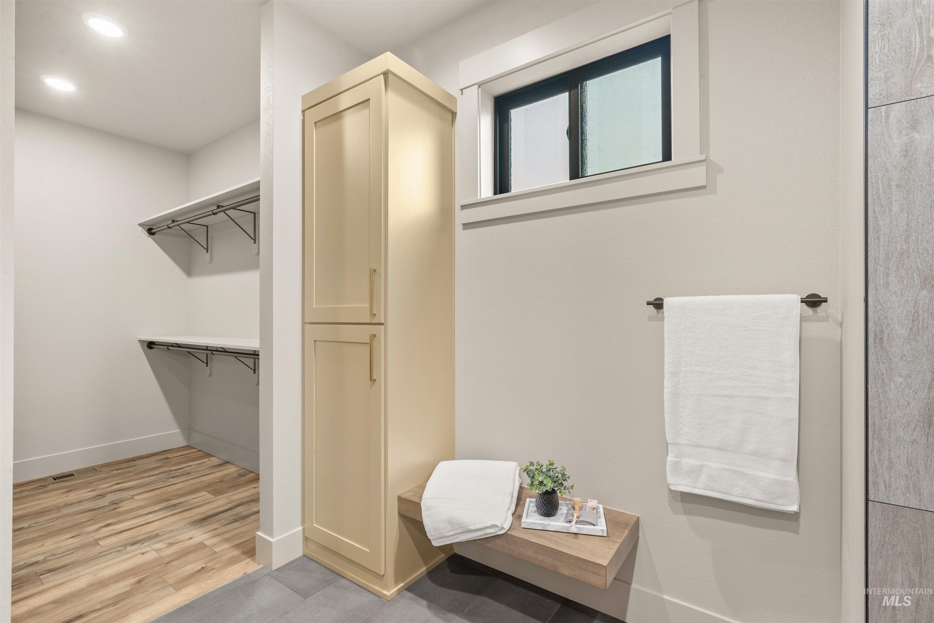 335 Warner Avenue Lewiston, ID 83501 - Photo 31 of 43 Bathroom featuring light wood-style floors and a walk in closet
