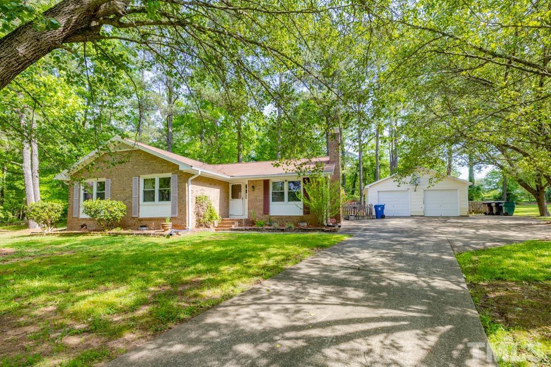 111 Larmack Court Durham, NC 27713 - Photo 1 of 24 a front view of a house with a yard and trees