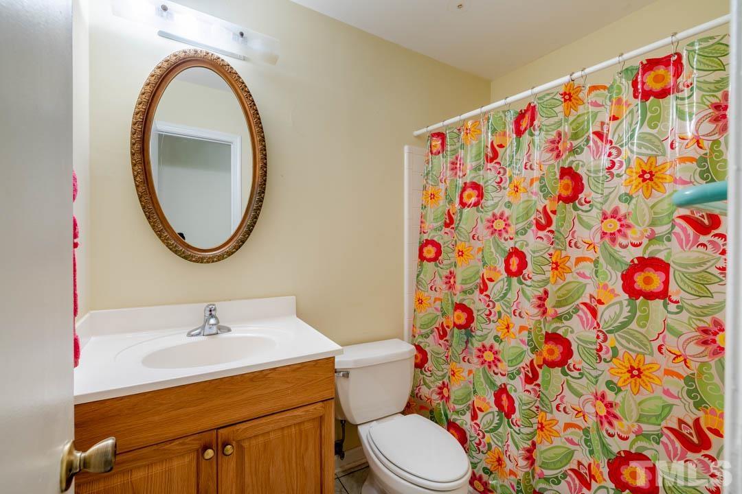 111 Larmack Court Durham, NC 27713 - Photo 14 of 24 a bathroom with a sink and a mirror