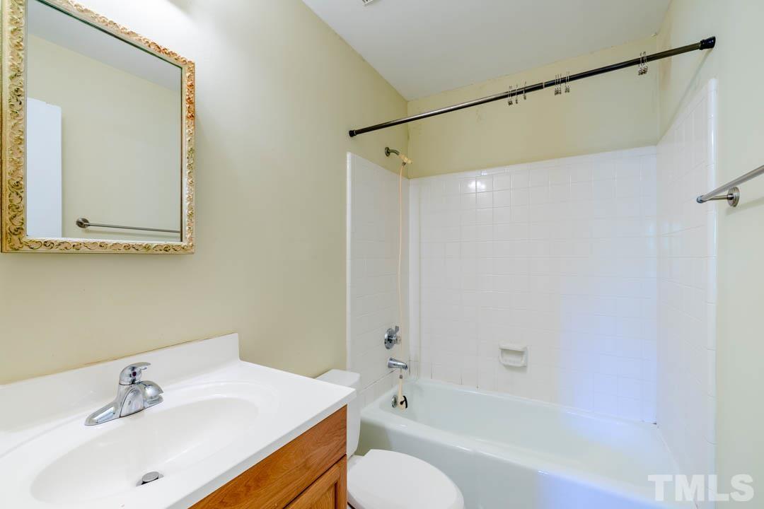 111 Larmack Court Durham, NC 27713 - Photo 17 of 24 a bathroom with a sink toilet and shower