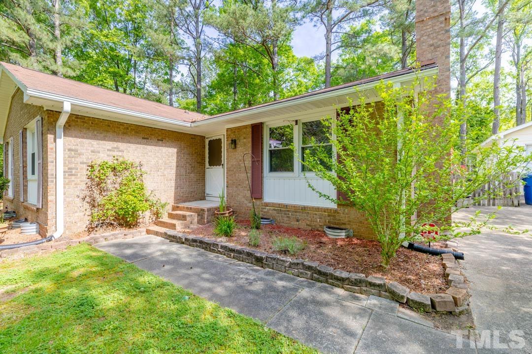 111 Larmack Court Durham, NC 27713 - Photo 2 of 24 a front view of a house with garden