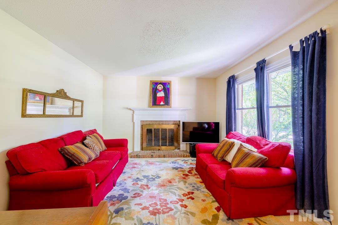 111 Larmack Court Durham, NC 27713 - Photo 24 of 24 a living room with furniture fireplace and a large window