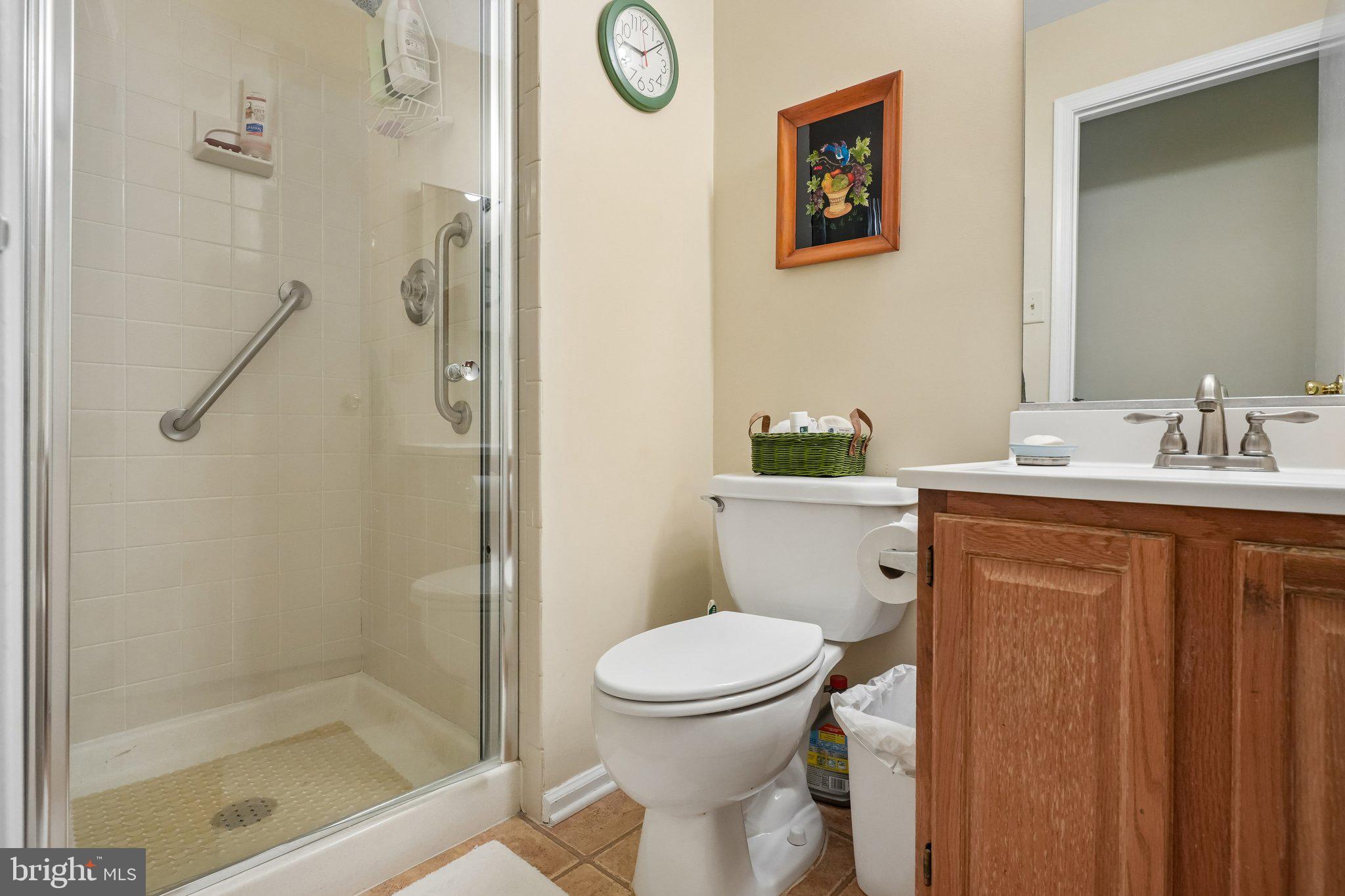 3303A Chadbury Road Mount Laurel, NJ 08054 - Photo 15 of 35 a bathroom with a sink a toilet and shower
