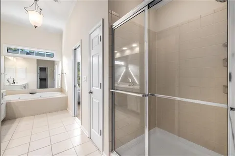 a bathroom with a tub and shower