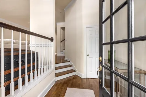 a view of an entryway with wooden floor