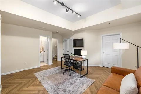 a bathroom with a sink a toilet and mirror