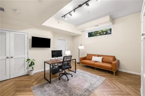 a view of balcony with wooden floor and outdoor seating