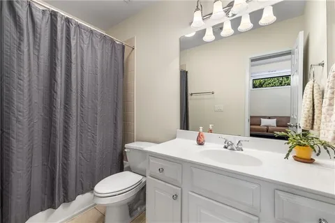 a view of balcony with wooden floor and fence