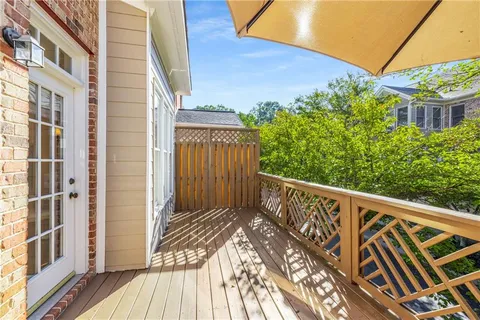 a front view of a residential apartment building with a yard