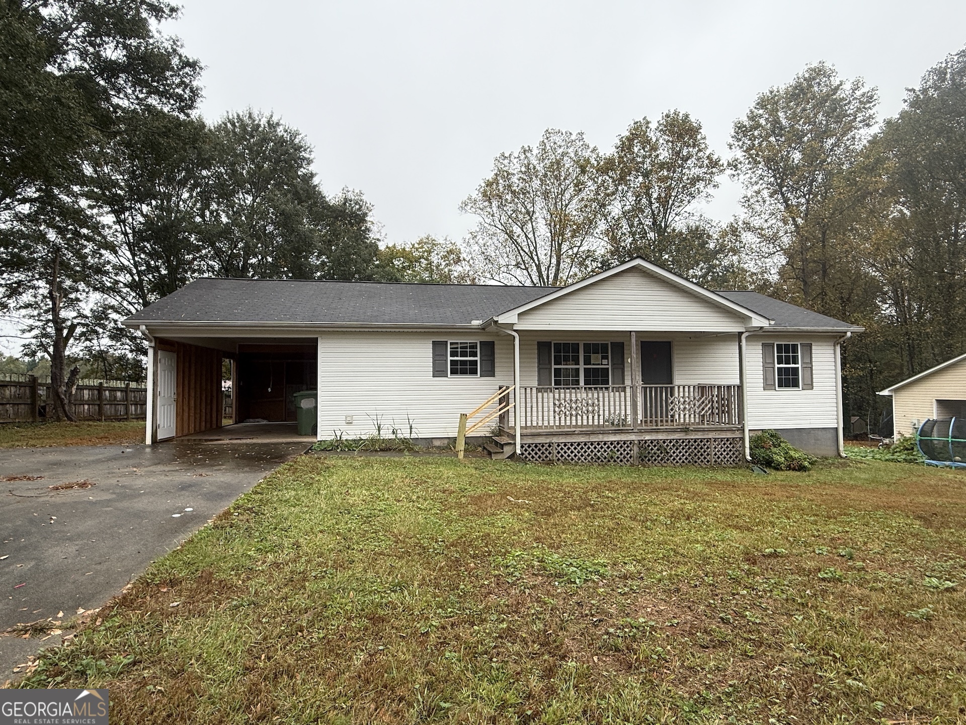 145 Goldust Avenue Clarkesville, GA 30523 - Photo 1 of 1 a front view of a house with a garden and trees