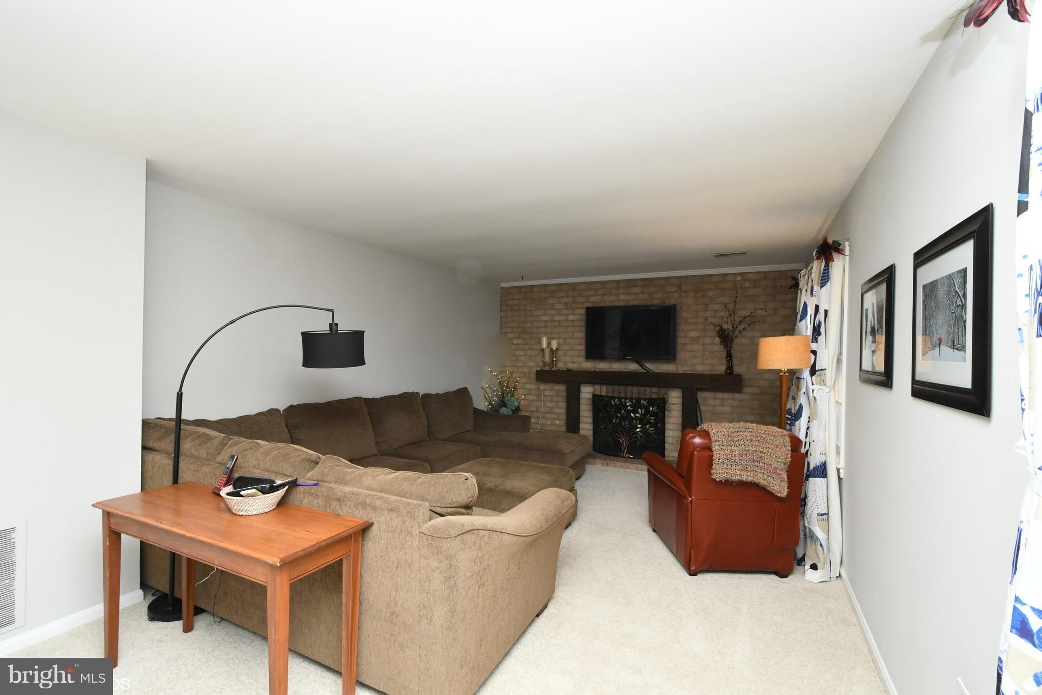 11506 Drop Forge Lane Reston, VA 20191 - Photo 20 of 29 Basement Rec Room with fireplace.