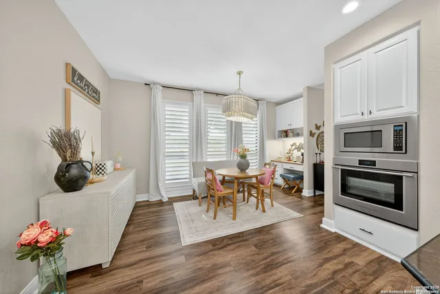 a living room with furniture wooden floor and a fireplace