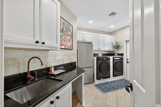 a kitchen with a sink stove and refrigerator